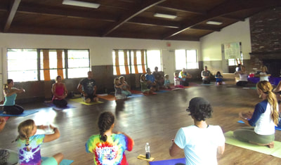 Families practicing yoga together at International Day of Yoga